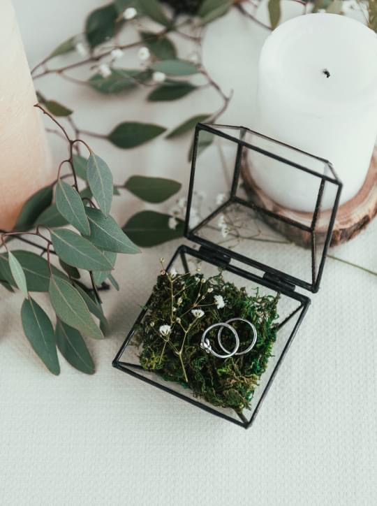 Bride and groom wedding rings photograph as part of the essential collection