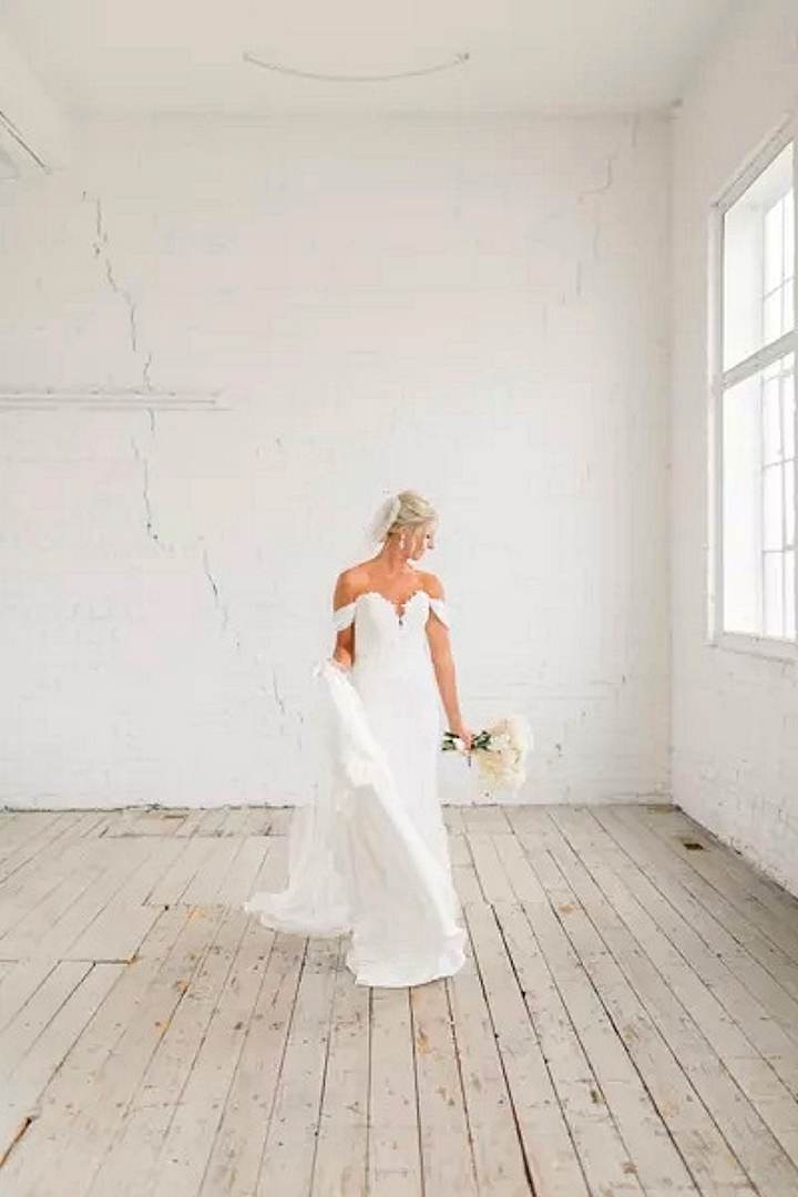 Bride photographed during natural wedding preparations in Kent